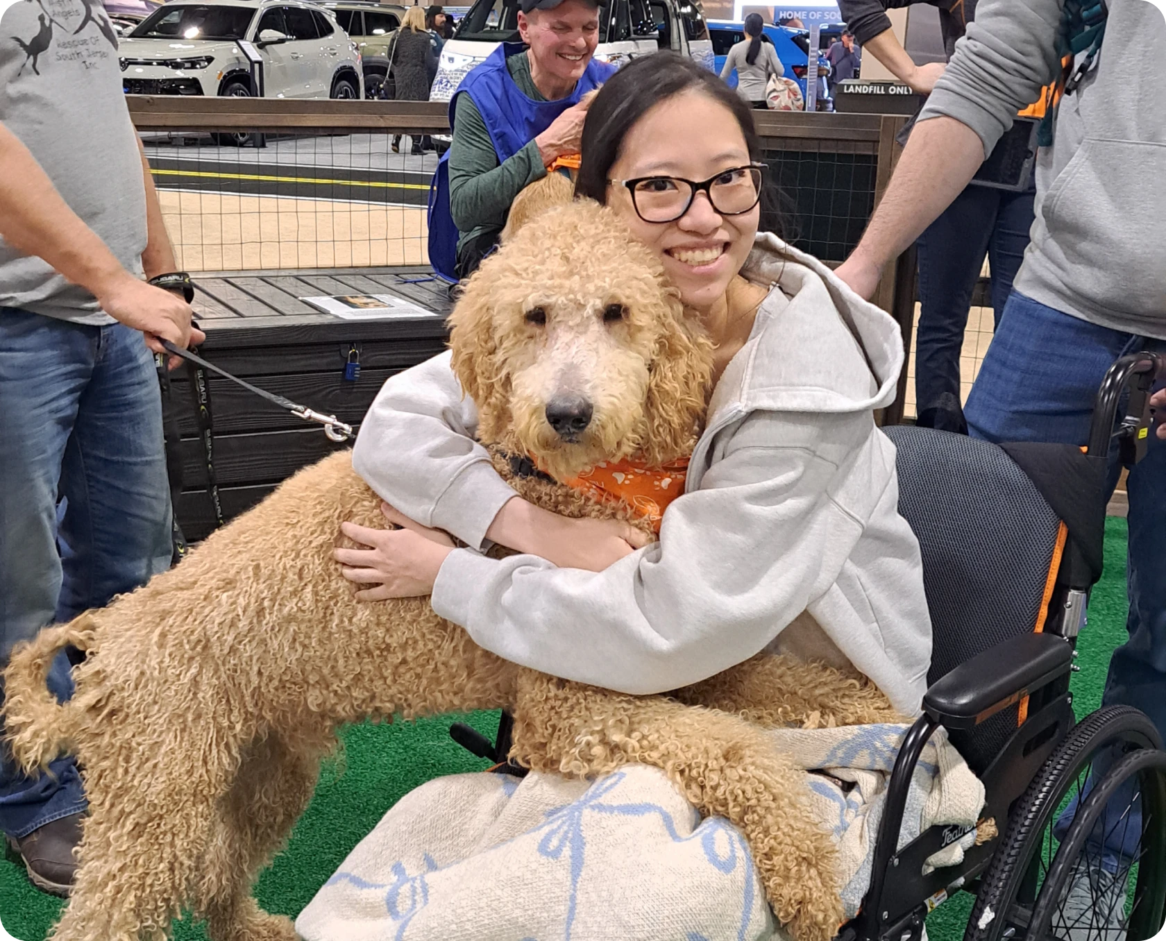 Smiling woman with a fluffy dog